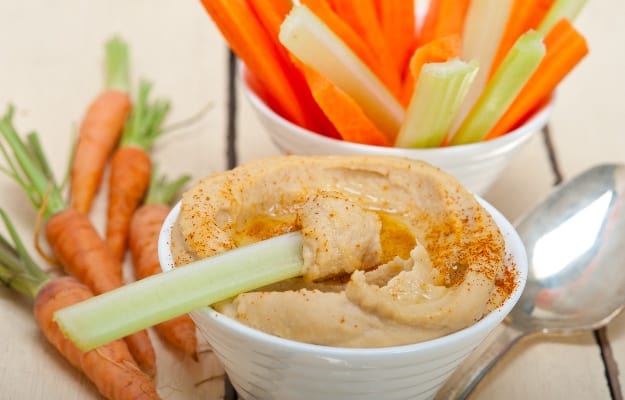 fresh hummus dip with raw carrot and celery - easy snacks | Tackle Poor Nutrition and Get Your Senior Eating Healthy With These Yummy Snacks