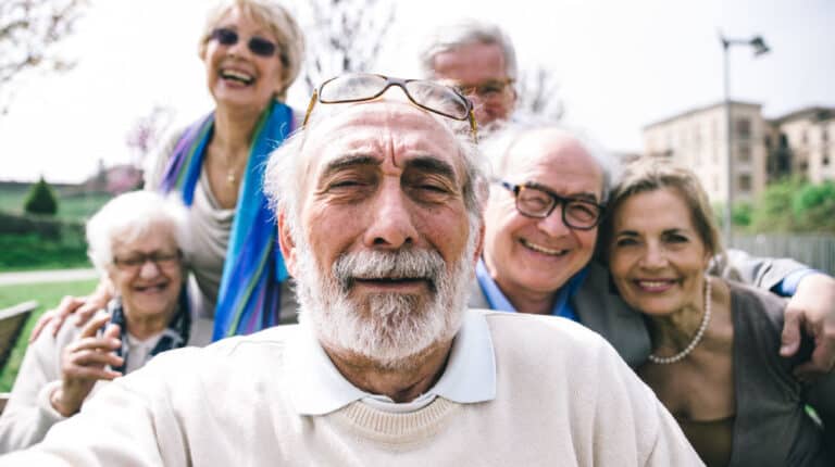 Group-of-senior-looking-in-camera | Here’s Why Seniors Thrive in an Assisted Living Community!