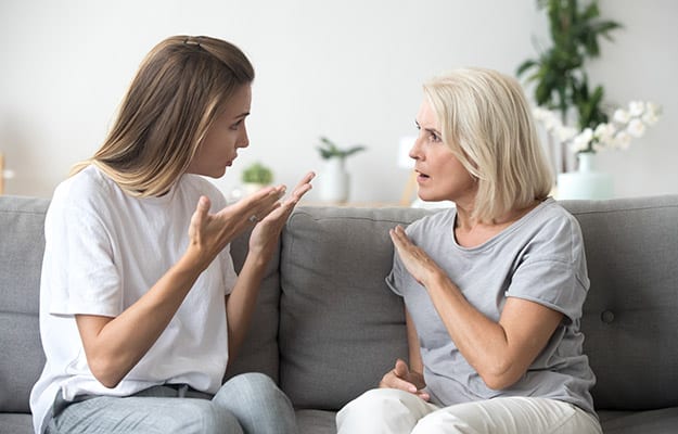 Angry young woman has disagreement with annoyed old mother in law, grown daughter arguing fighting quarreling with senior elderly mom, different age generations bad relations family conflict | 8 Proven Ways To Effectively Communicate With Your Aging Parents