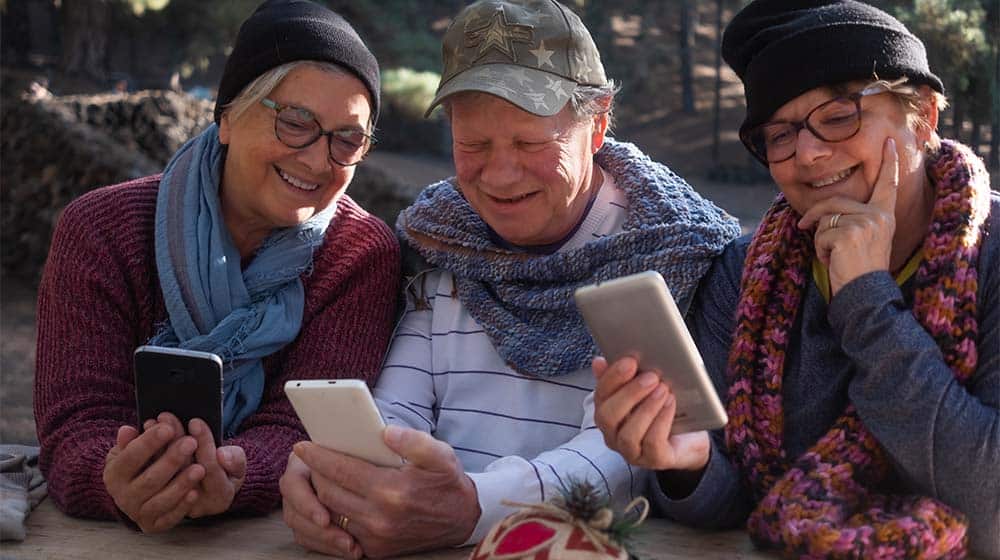 Smiling-group -of-friends-passionate-about-social-media | 5 Engaging Social Media Platforms Seniors Will Enjoy