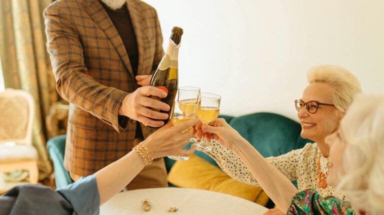 A-Group-of-People-Toasting-Drinks-14-New-Year's-Eve-Party-Ideas-For-Senior-Family-Members