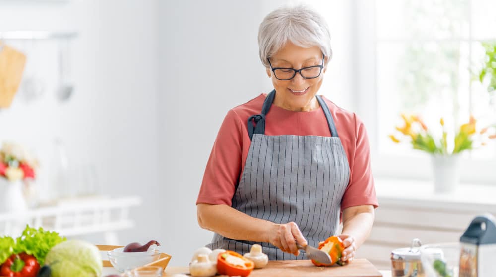 BLOG_12O_senior-women-cooking_Distinguish-Good-Cholesterol-And-Bad-Cholesterol_header | 14 Low Cholesterol Food List For Elderly Family Members