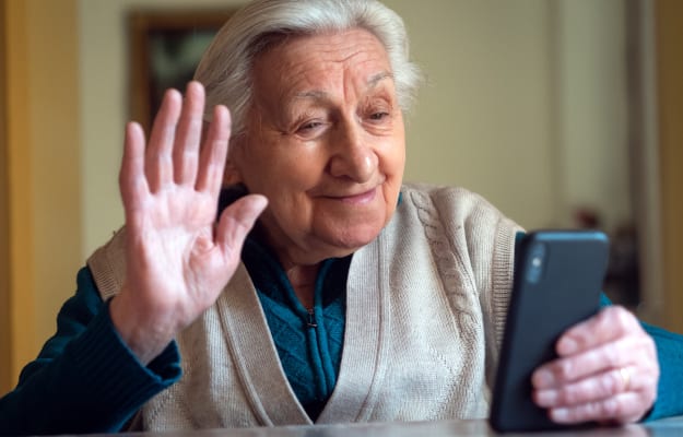 happy-grandmother-is-making-video-call_Stay-In-Touch_ss_body | 5 Genius Tips For Effective and Efficient Long-Distance Caregiving