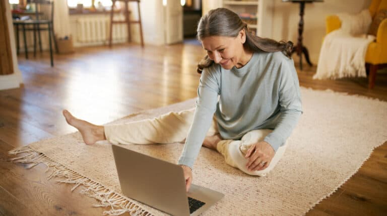 senior-doing-yoga-online_5-Amazing-Benefits-Of-Yoga-For-Seniors_ss_feature | 5 Amazing Benefits Of Yoga For Seniors & How To Get Started