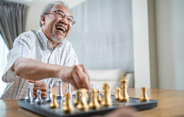 portrait-asian-senior-elderly-male-playin-chess _ 8 Memory Board Games Perfect For Your Beloved Family Members body ss