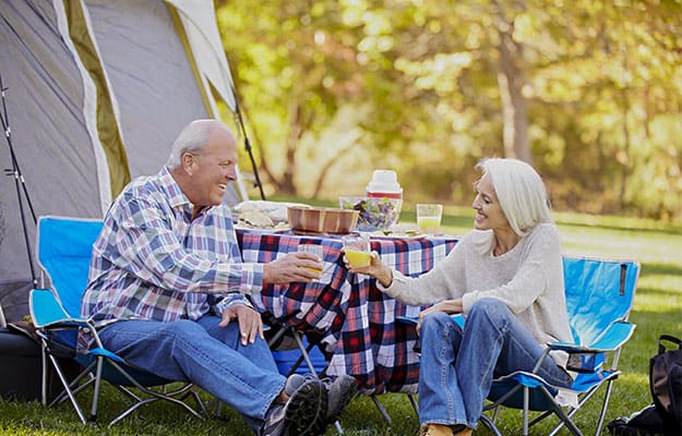 Senior-Couple-Enjoying-Camping-Holiday-In-Countryside---Camping-Tips-for-Senior-Citizens---ss-body