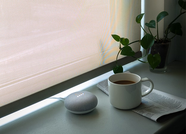 12Oaks-A smart speaker assistant with coffee and newspaper on a window bay-ss-What are smart speakers_