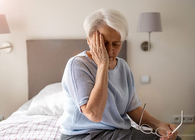 12Oaks-Senior woman suffering from a headache-ss-How Does Stress Affect Seniors_