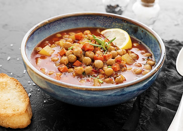 12Oaks-Appetizing chickpea soup served with lemon and bread-as-Chickpea Curry Bread