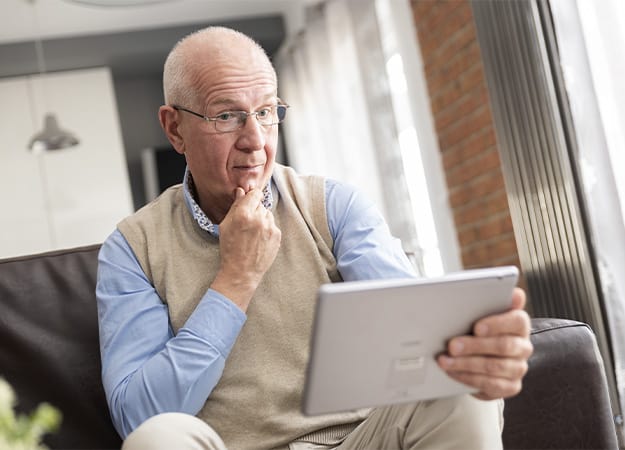 12Oaks-Confused senior man using a digital tablet-as-5. Stay Skeptical of Extreme Deals