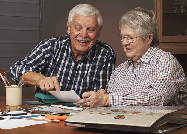 12Oaks-Happy senior couple making a scrapbook-as-5. Do Other Art Activities