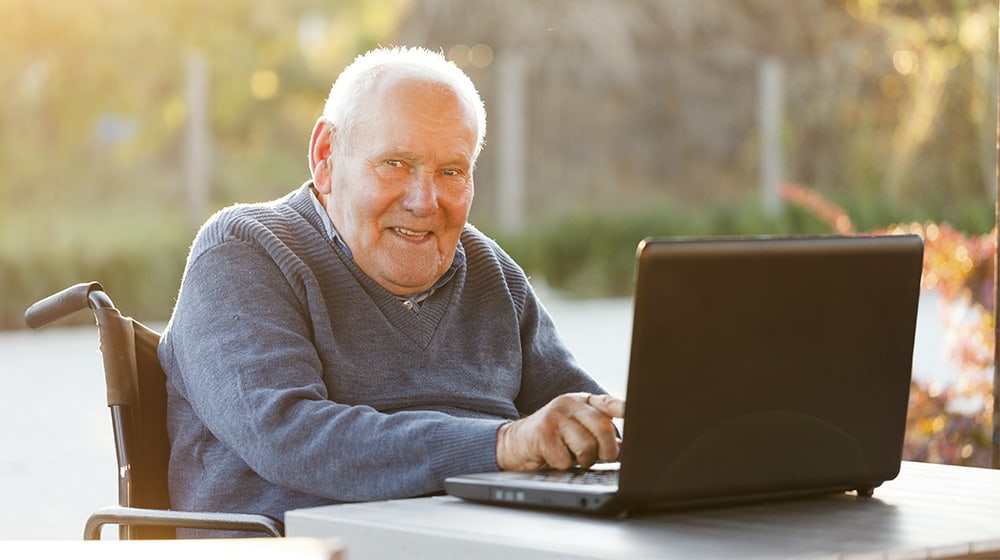 12Oaks-Old man with laptop-as-Online Shopping Tips For Seniors As They Prepare For Black Friday-Feature