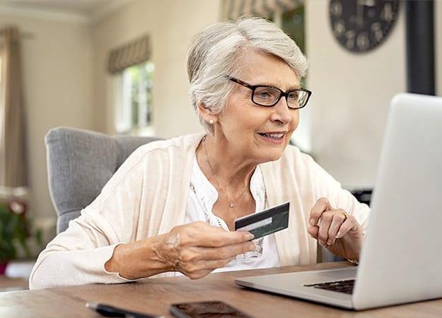 12Oaks-Old woman paying bills online-as-6. Make Payments With A Credit Card