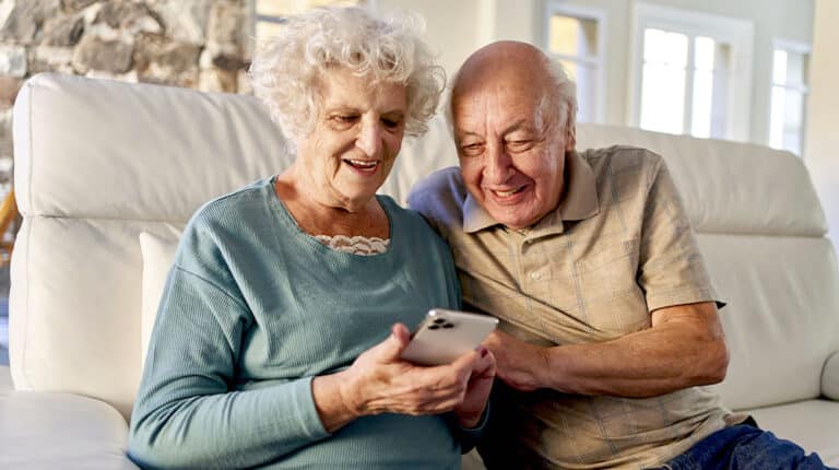 12Oaks-Senior couple, smartphone-ss-7 Social Media Apps Older Adults Should Take Advantage Of-Feature