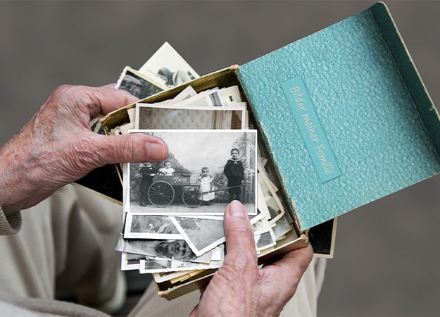 12Oaks-Senior looks at old family photos, memory of the past-as-Did You Have Any Big Dreams When You Were a Kid_