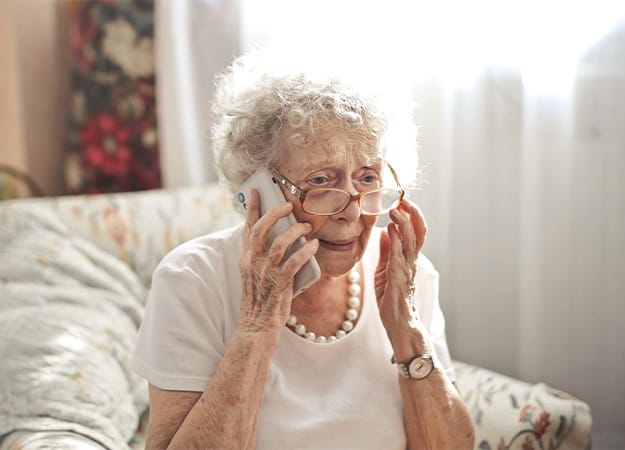 12Oaks-senior woman making call-as-1 211 Telephone Service
