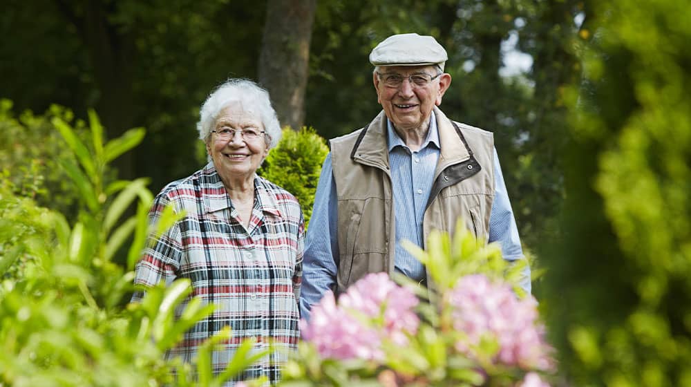 12Oaks-Happy senior couple in garden-as-Life After 65- 6 Tips To Improve Quality Of Life Of Older Adults-Feature