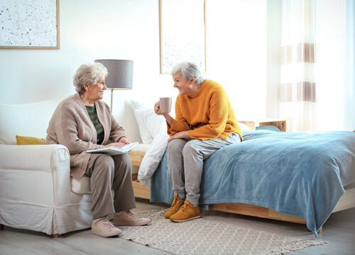 12Oaks-Elderly women spending time together in bedroom-as-Assisted Living Cost- Important Factors Affecting The Total Cost