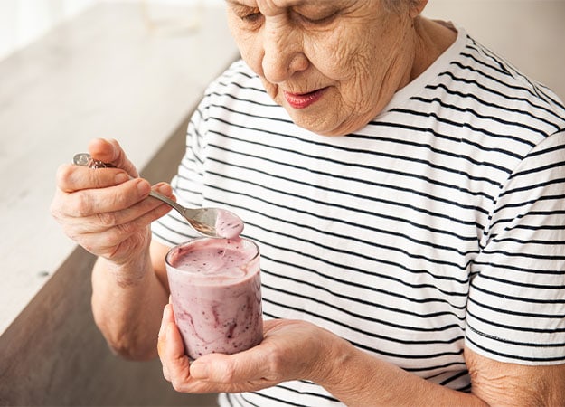 12Oaks-old woman eating yogurt.-as-1 The Most Important Meal of The Day