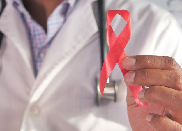 12Oaks-Doctor holding HIV ribbon-pexels-9 Oral Cancer