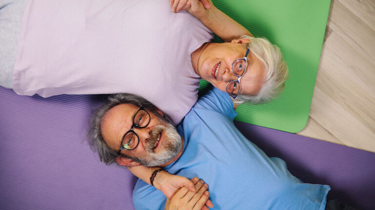 12Oaks-Elderly couple making yoga-pexels-The Benefits of Laughter Yoga for Seniors-Feature