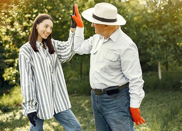 12Oaks-Young woman and old man giving high five-pxls-7 Regain A Sense of Purpose