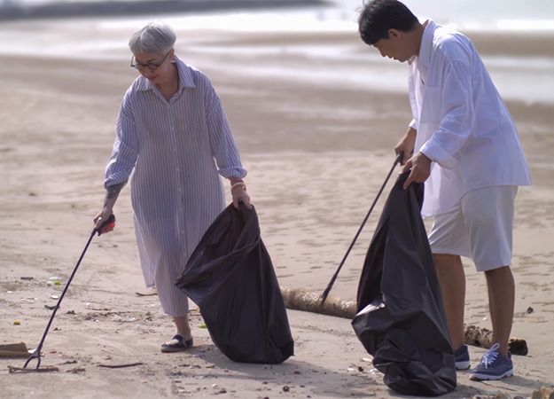 12Oaks-asian-retired-couple-picking-up-trash-on-the-beach-vecteezy-1 Promote Physical Health