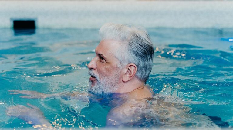 bearded-man-in-the-swimming-pool-The-Benefits-of-Water-Aerobics-for-Seniors