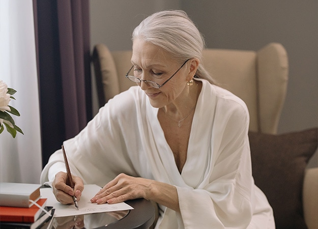 12Oaks-Elderly woman writing on paper-pxls-2 Embrace the Beauty of Poems