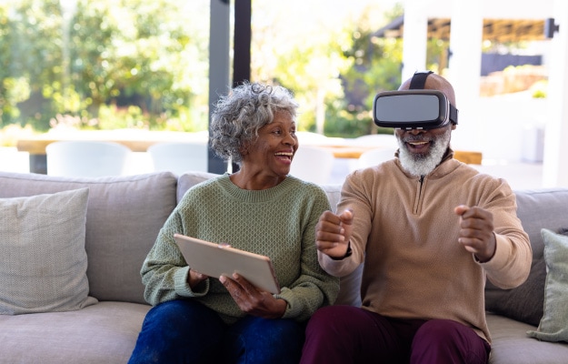 African-american-senior-man-enjoying-virtual-reality-Some-VR-Sets-and-Applications-to-Consider