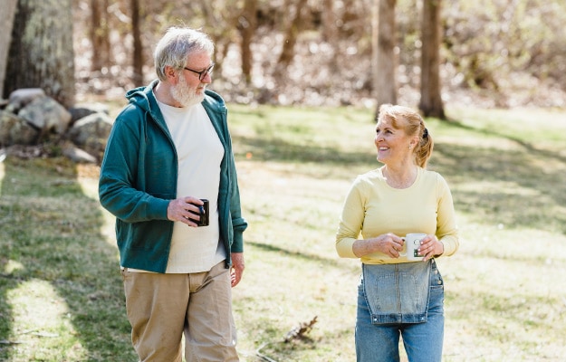 Elderly-Couple-enjoying-walking-by-the-woods------Increases-Physical-Health_px_body