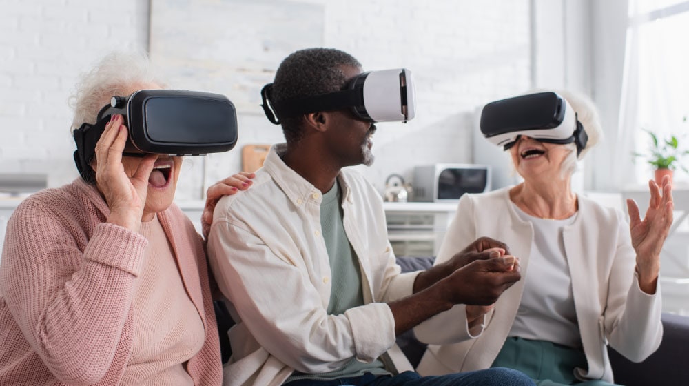happy-seniors-in-vr-headsets-on-couch-in-nursing-home-Digital-Dawn-Embracing-Virtual-Reality-in-Senior-Living