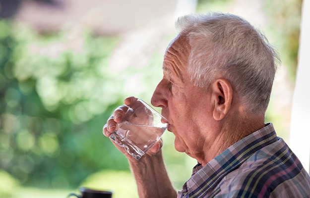 12Oaks-Portrait-of-senior-man-drinking-water-from-glass-ss-8-Consider-Supplements