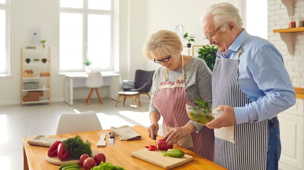 12Oaks-elderly-couple-cooking-lunch-cnv-The-Role-of-Nutrition-in-Bone-Health-for-Seniors