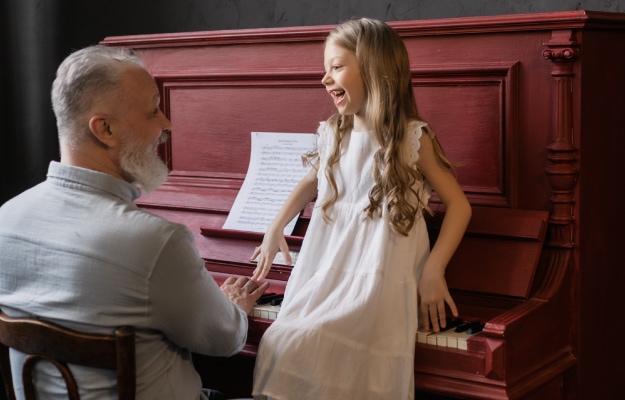 Grandfather-and-Granddaughter-playing-piano_Engaging-Activities---8-Share-Hobbies-_-Interests_px_body