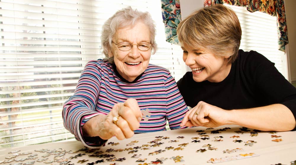 Elderly-Woman-Doing-Puzzle-10-Interesting-Montessori-Activities-for-Parents-With-Dementia
