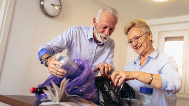 mature-aged-older-couple-recycle-plastic-The-Seniors-Guide-to-Sustainable-Living