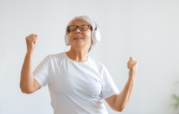 happy-senior-listening-to-music-and-dancing-The-Benefits-of-Dance-In-Seniors-8-Elevates-Mental-Health