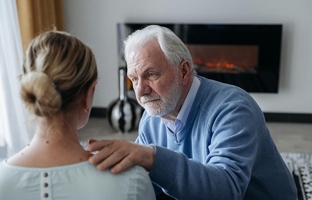 Elderly-Man-Comforting-a-Woman-Signs-and-Symptoms-of-PTSD-In-Older-Adults-px-body
