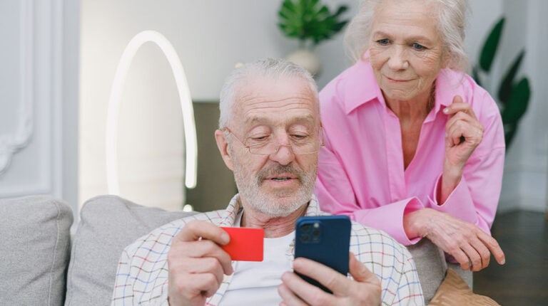 12Oaks-Elderly-man-and-woman-making-payment-via-bank-card-pxls-6-Safe-Online-Banking-Tips-for-Your-Parents