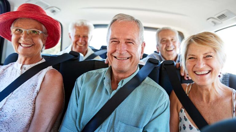 12Oaks- Senior Friends Sitting In Back Of Van Being Driven To Vacation-as-Exploring Senior-Friendly Travel Tours- Adventure and Safety Combined-Feature