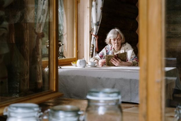 Elderly Woman Reading on the Table pexels