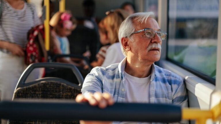 Elderly man in public transport