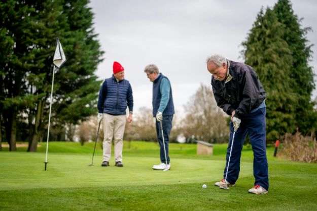 Elderly Men Playing Golf