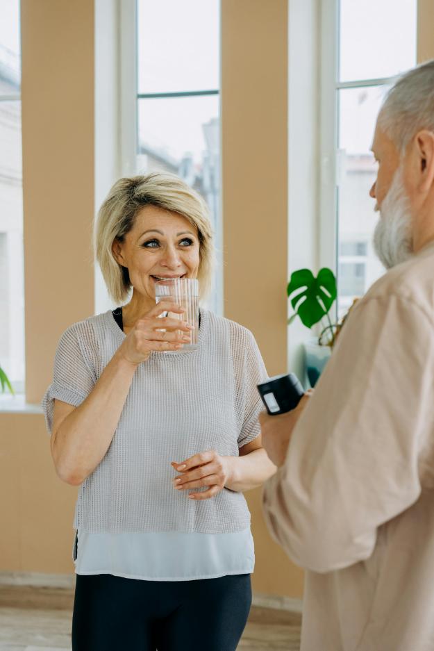 Elderly Woman Drinking a Glass of Water