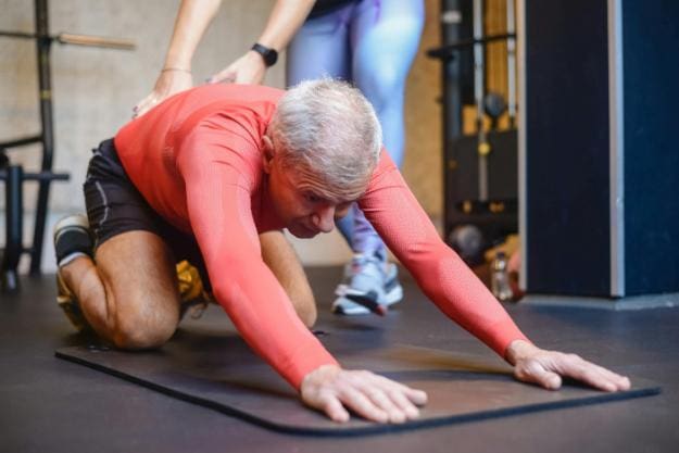Elderly Man Stretching His Body | leg strengthening exercises for seniors px