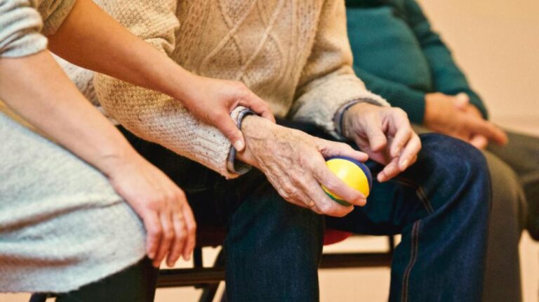 Person Holding a Stress Ball px featured image What Insurance Covers In-Home
