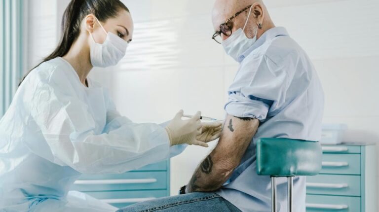 Doctor Injecting a Patient | vaccinations for seniors px featured image
