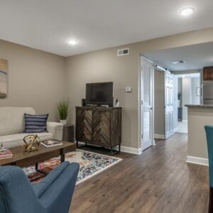 the atriums senior living community overland park Living Room and Kitchen 1