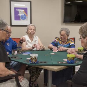 the atriums senior living community overland park Residents playing cards 1
